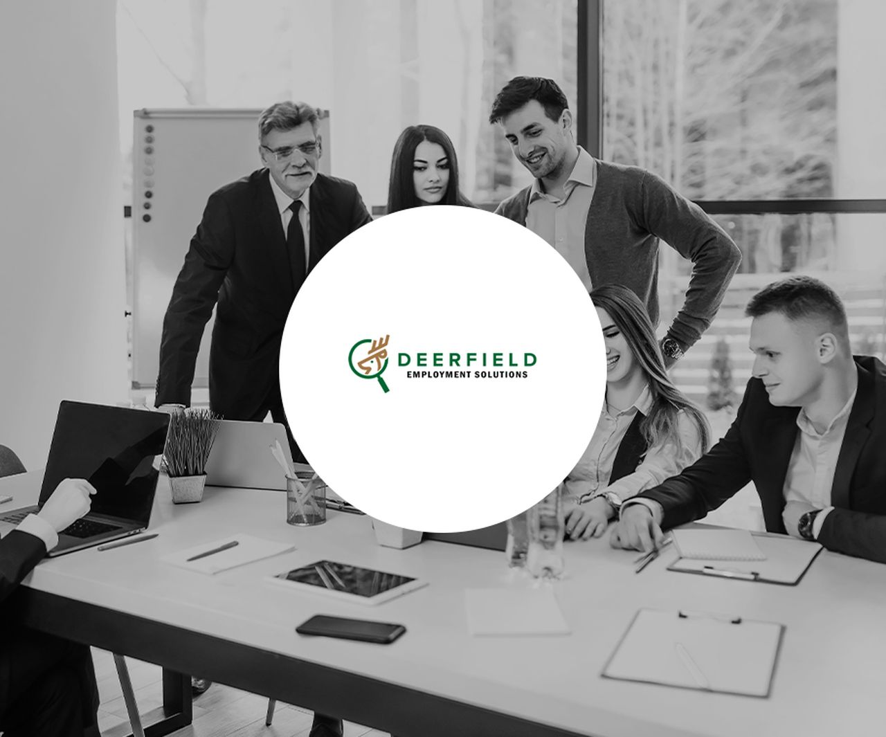 Deerfield Employment Solutions team meeting discussion in modern office environment