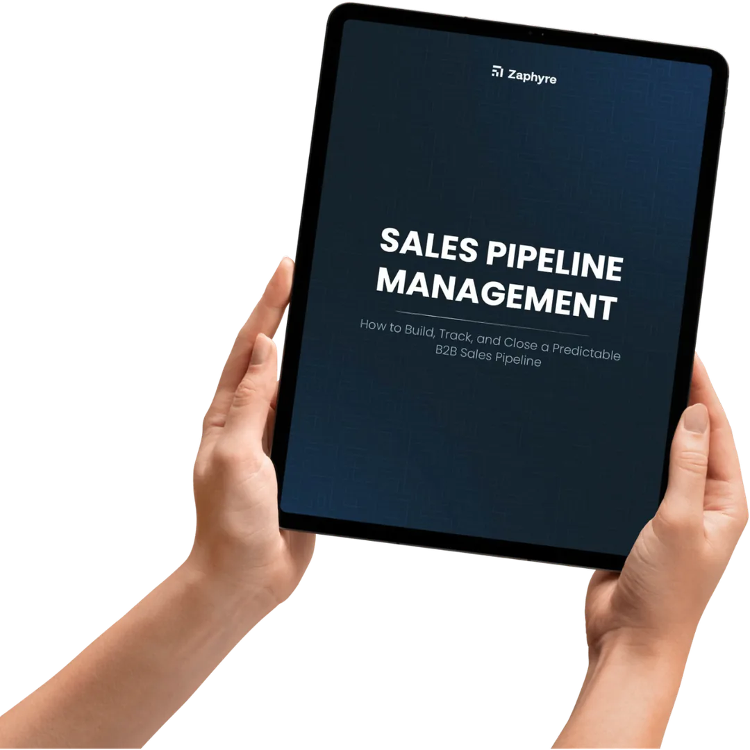 Hands holding a tablet showing the cover of Zaphyre's Sales Pipeline Management playbook — how to build, track, and close a predictable B2B sales pipeline